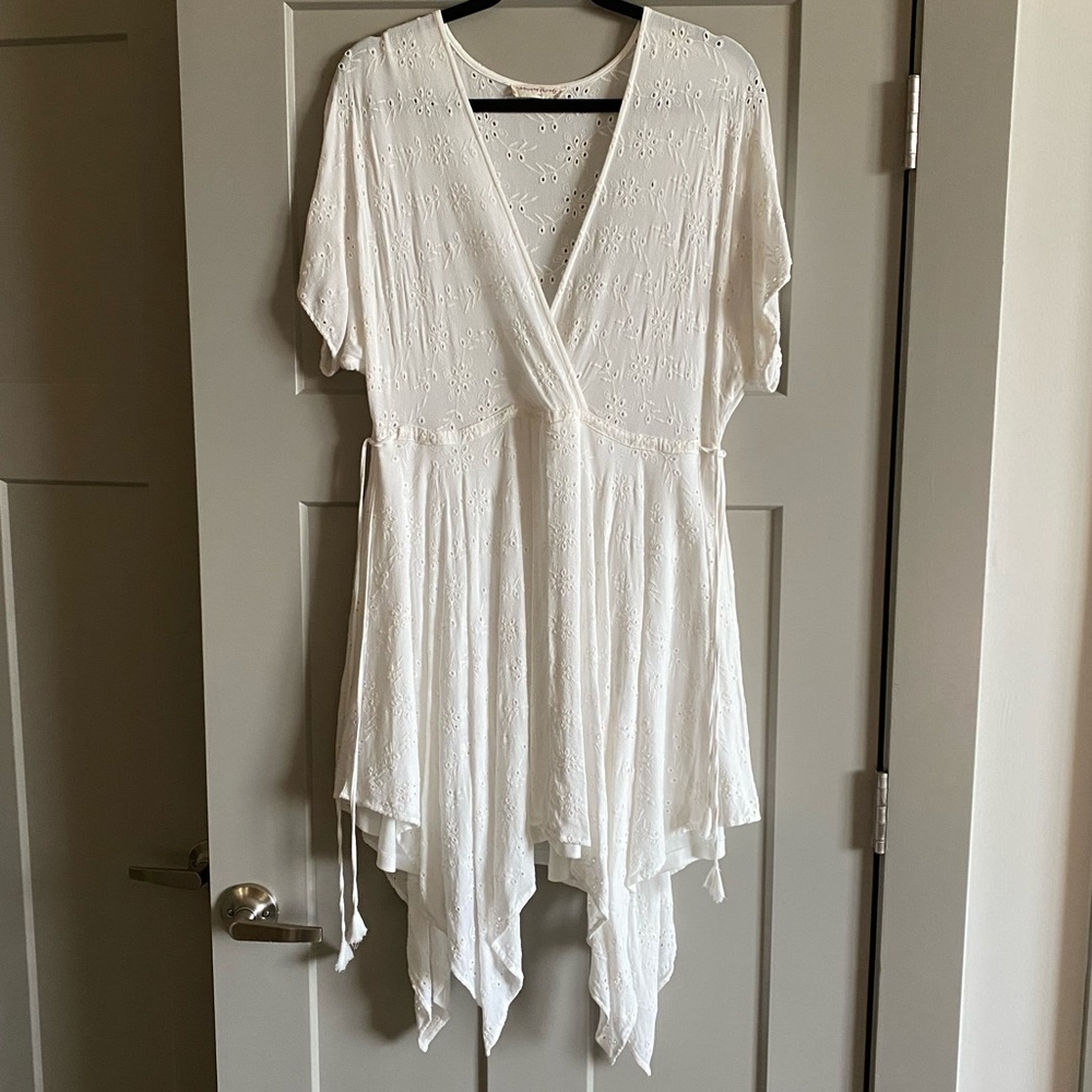 Asymmetrical hem mini dress with eyelet detail